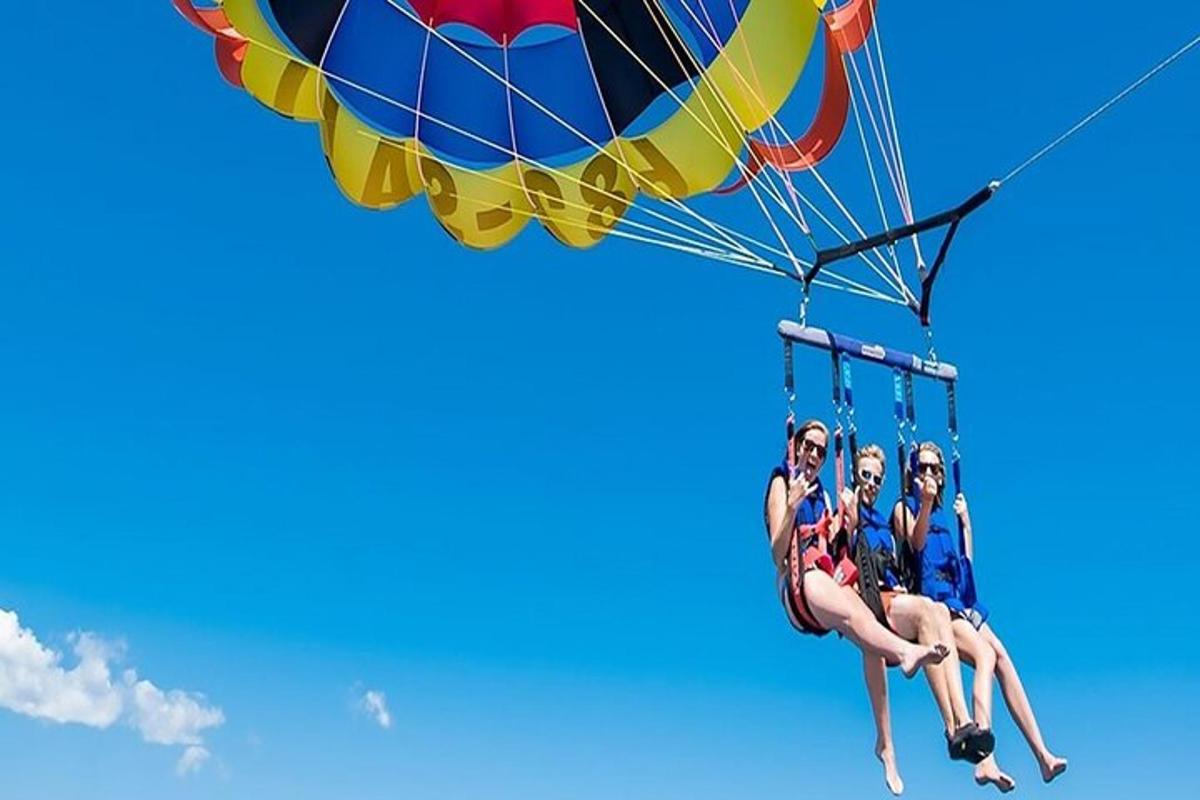 a group of people riding on a parachute