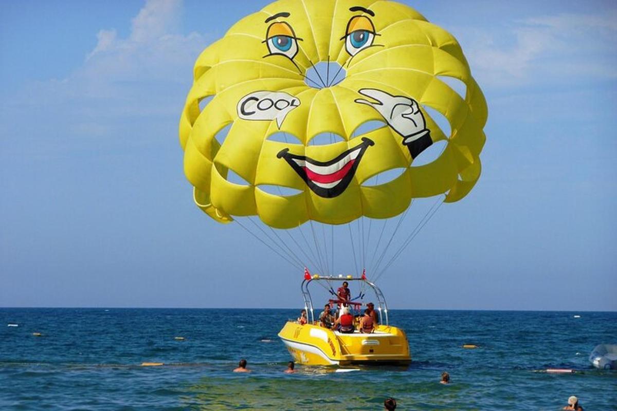 a large yellow balloon flying over the ocean