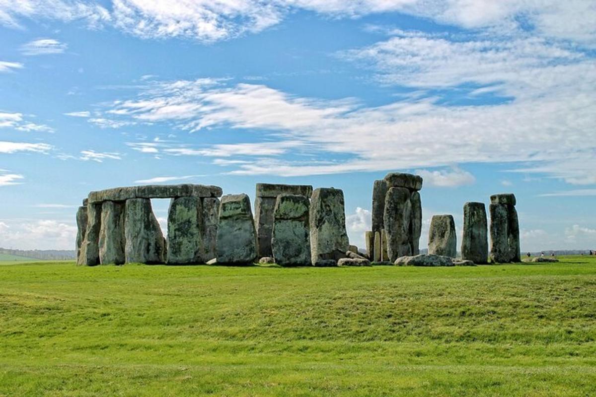 a group of stonehenge stones in a field