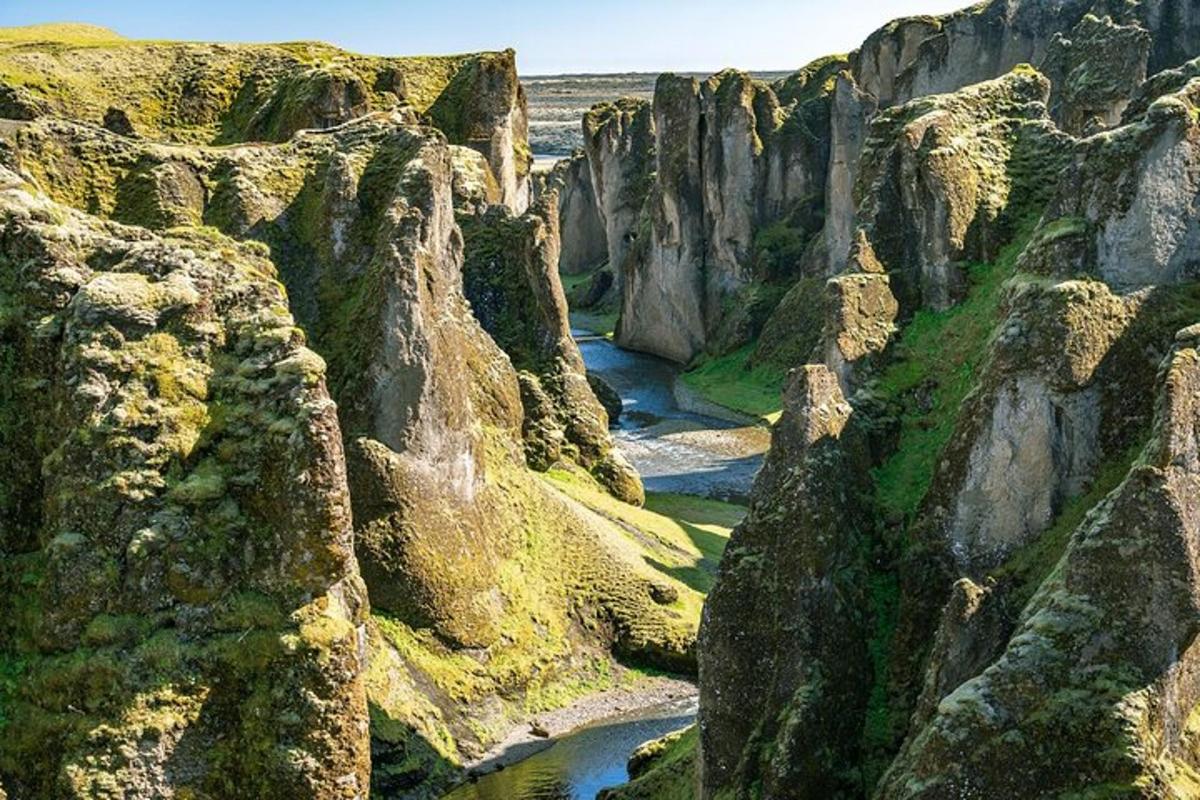 a canyon with a river between two large rocks