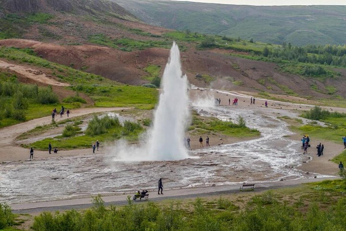 a water fountain in the middle of a river