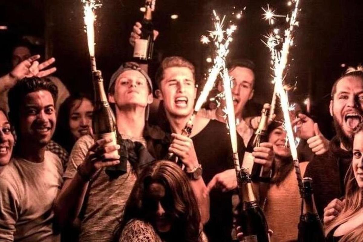 a group of people holding sparklers in their hands