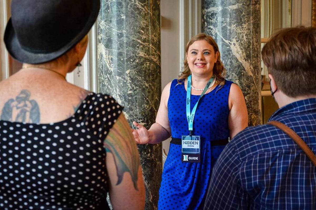 a woman standing next to a man with a tattoo