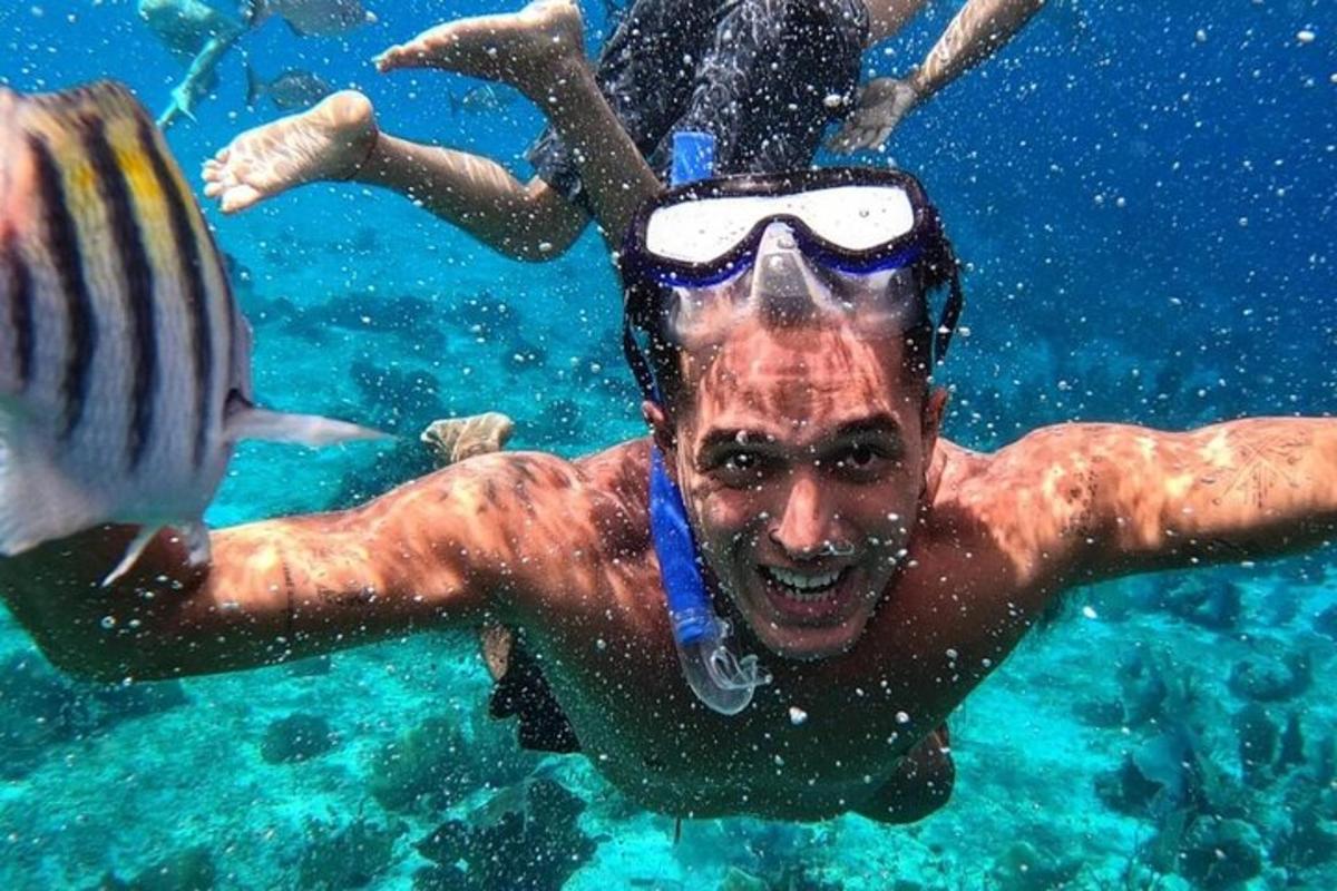 a man swimming in the water with a snorkel