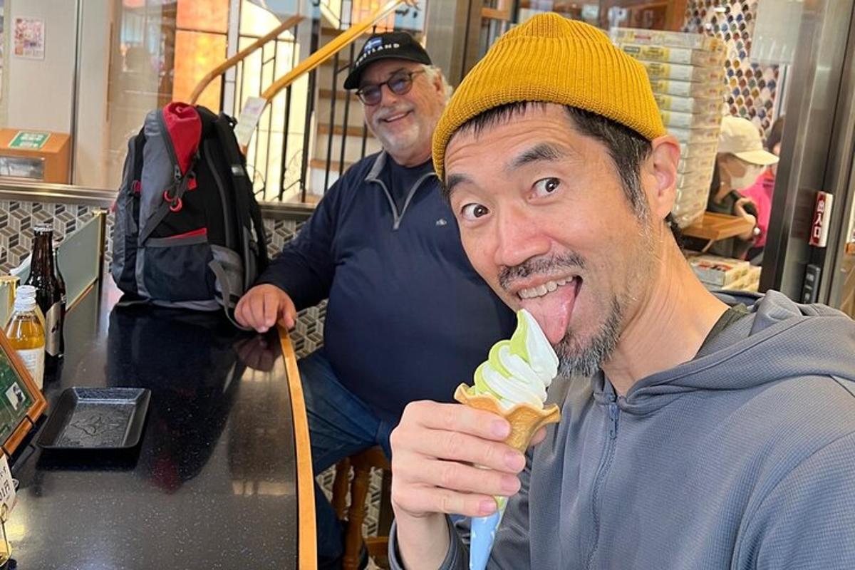a man eating an ice cream cone in a store
