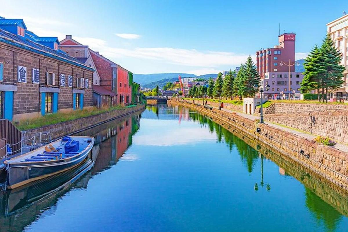 a river with a boat in the middle of a city