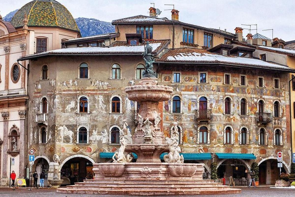a large building with a fountain in front of it