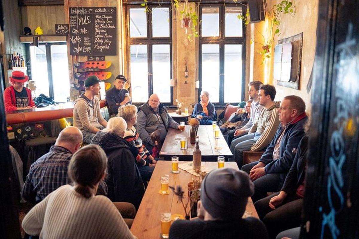 a group of people sitting around a table in a restaurant