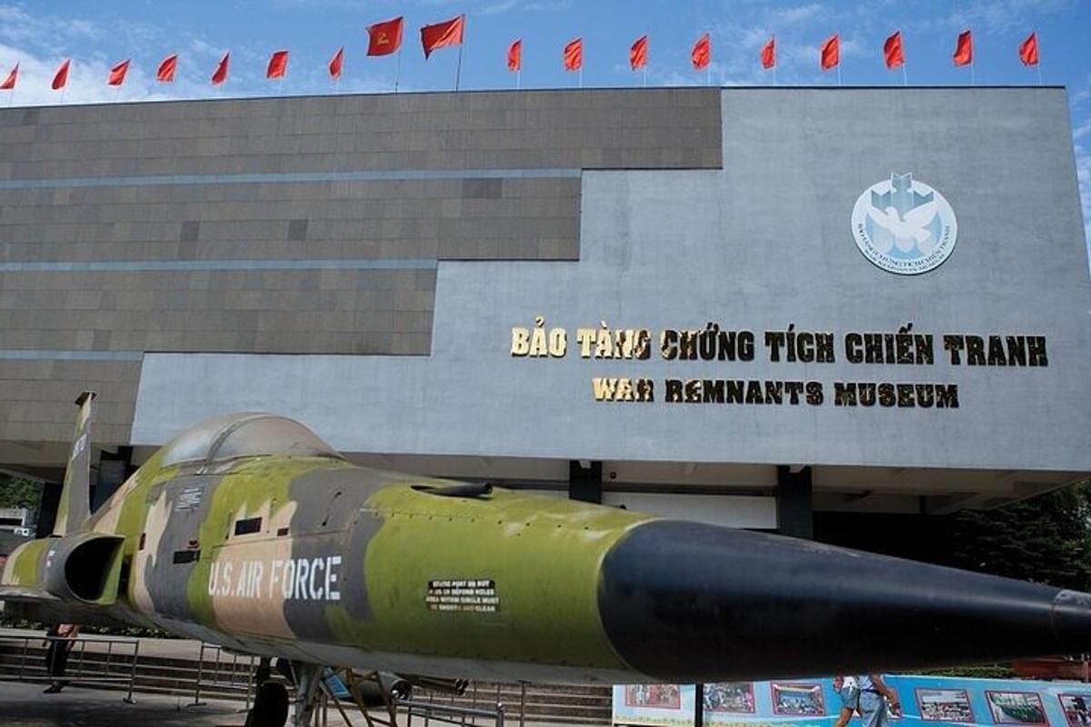 a military plane parked in front of a building