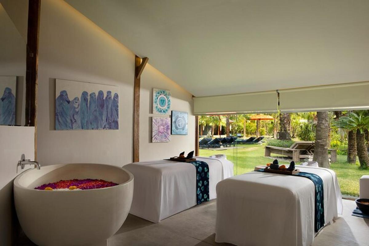 a room with two tables and a bath tub