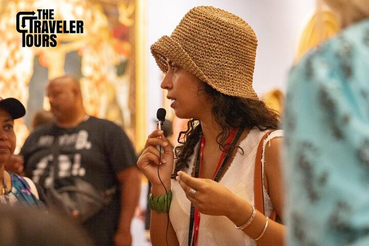 a woman in a hat speaking into a microphone
