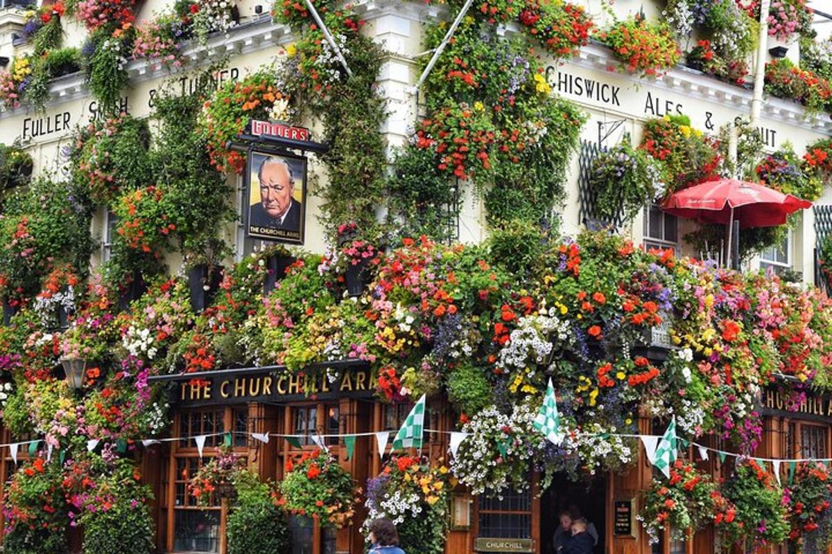 a building covered in lots of flowers and plants