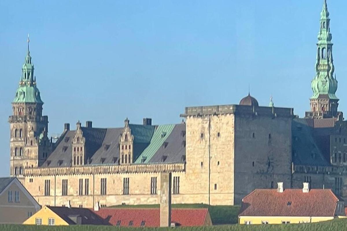a large castle with two towers and buildings