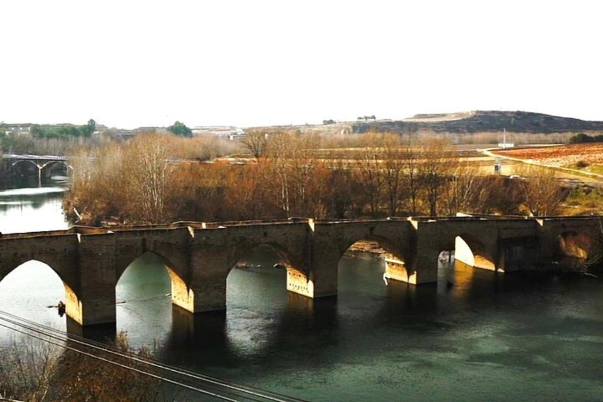 a stone bridge over a river with water