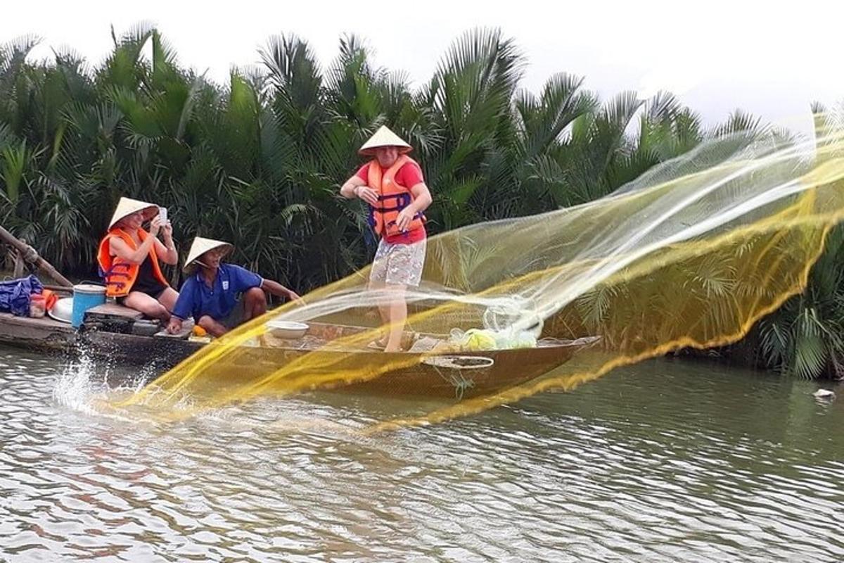 a man in a boat with a net in the water