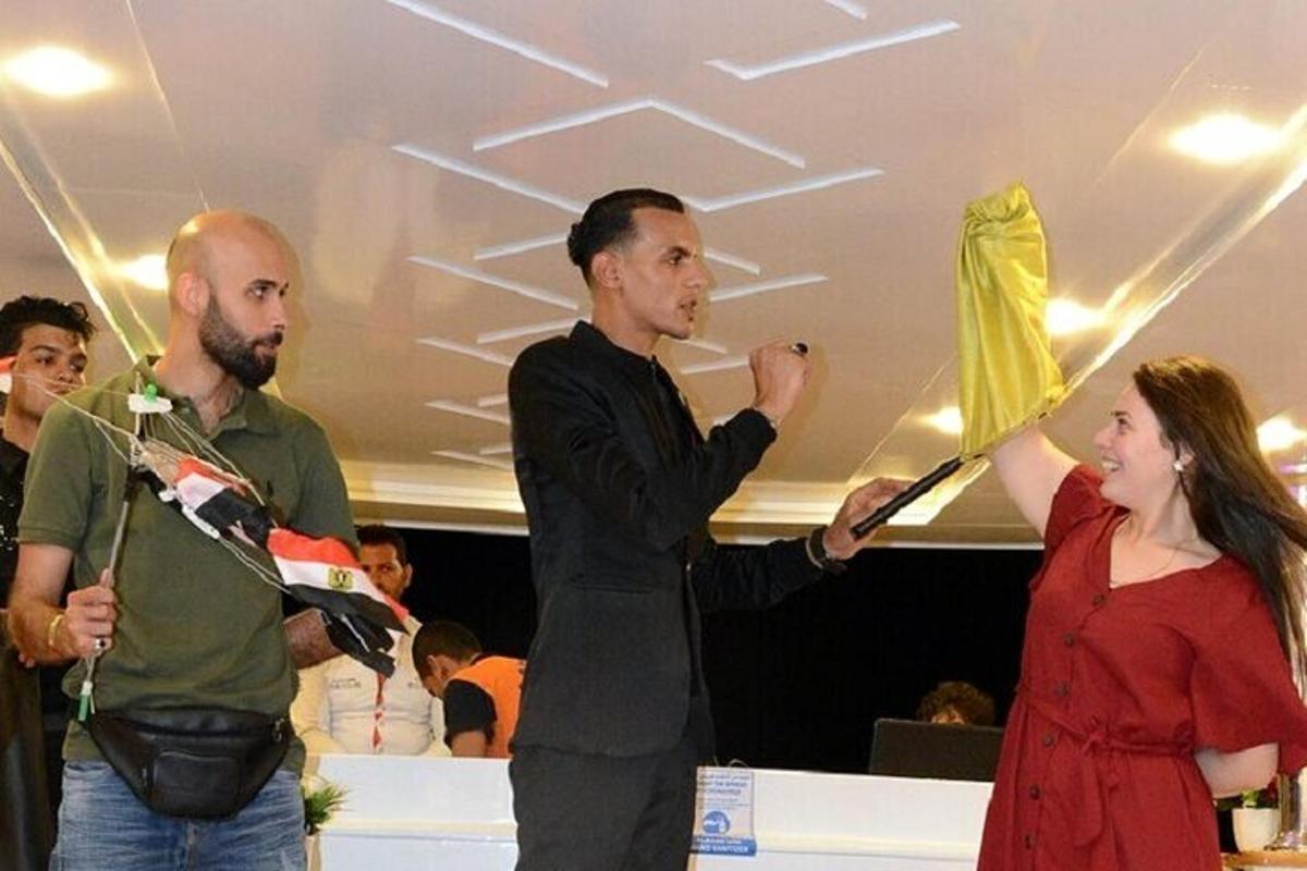 a man and a woman holding up a flag