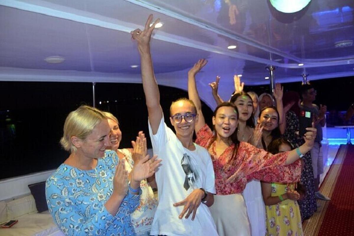 a group of people with their hands in the air