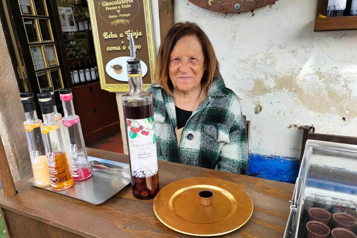 a woman sitting at a counter with a bottle of wine