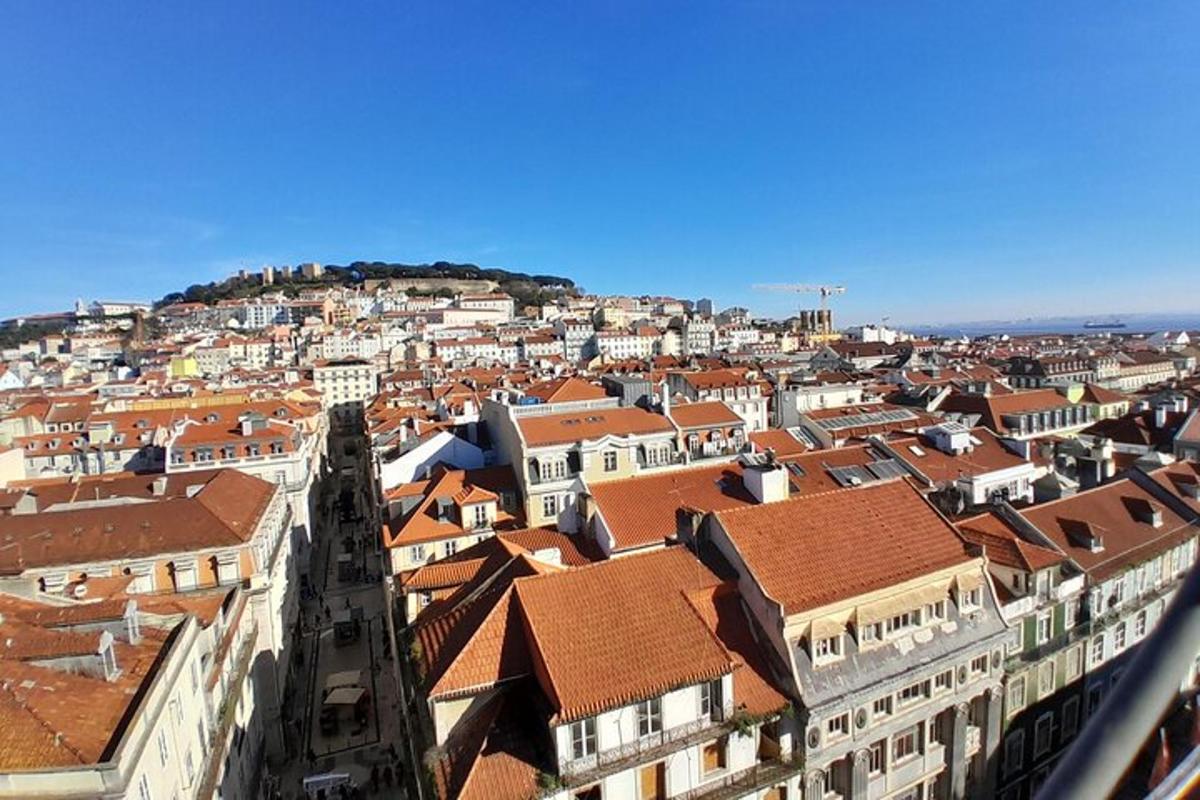 a view of a city with buildings and roofs