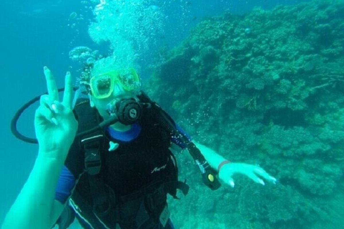 a person holding a camera in the water