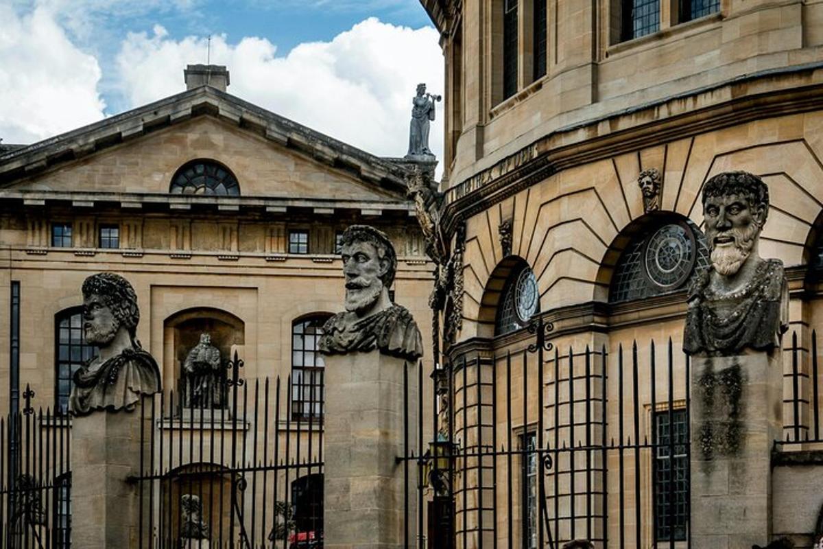 a building with statues of faces on the side of it