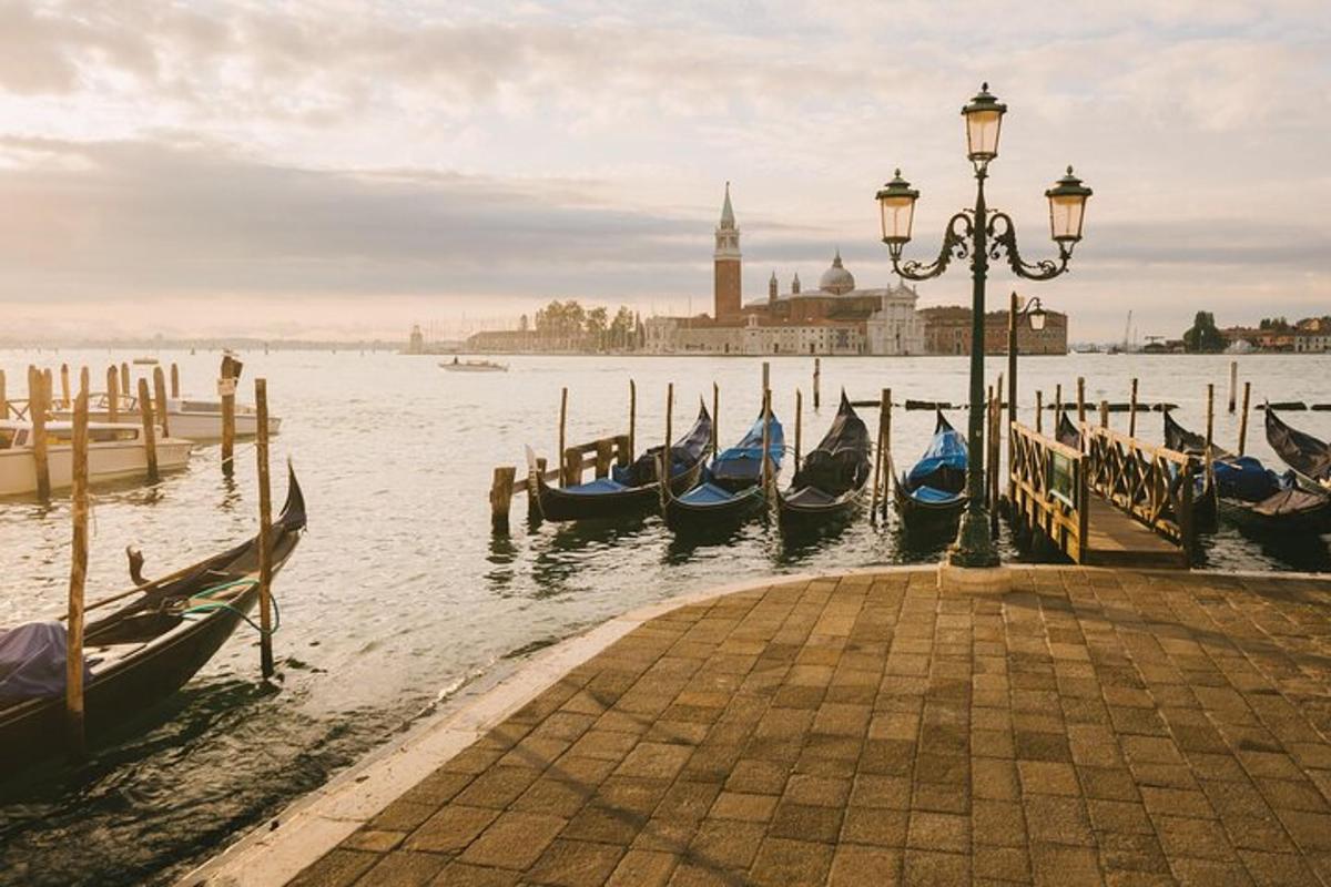 a group of gondolas are docked next to a pier