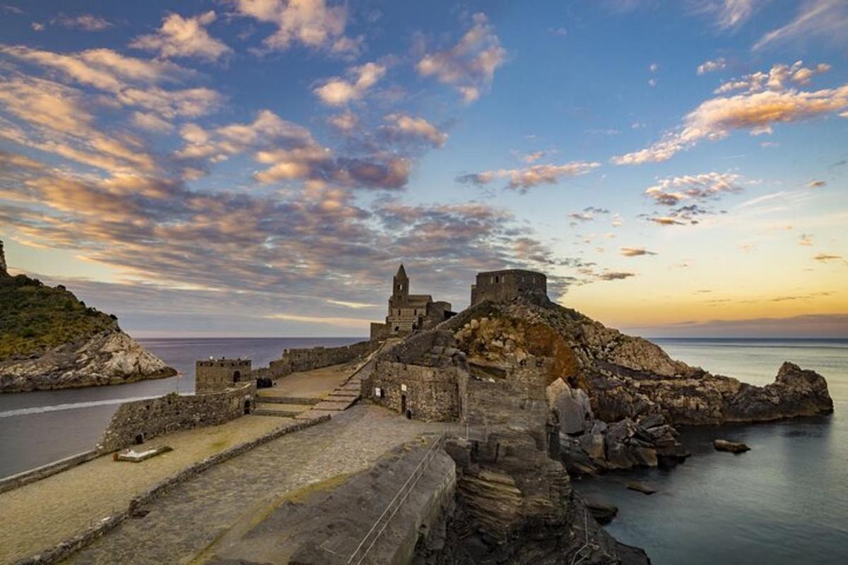 an old castle on a rocky island in the water