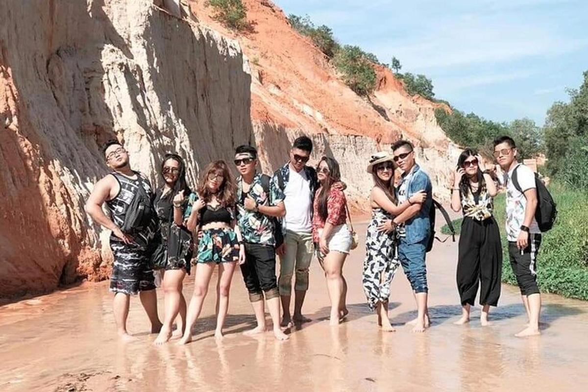 a group of people walking in the water