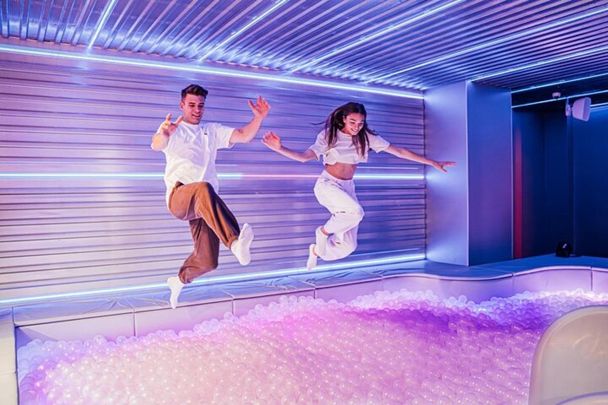 a man and woman jumping in the air on a stage