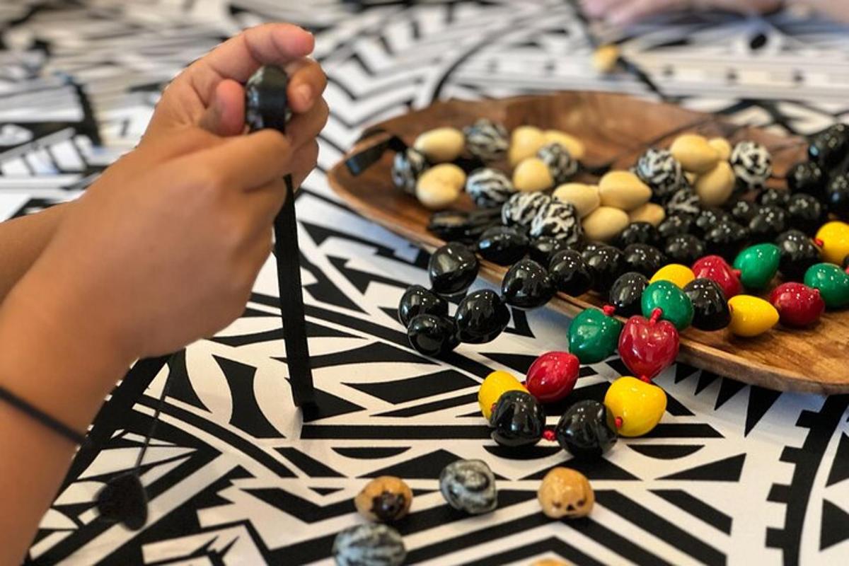 a person is playing with beads on a table