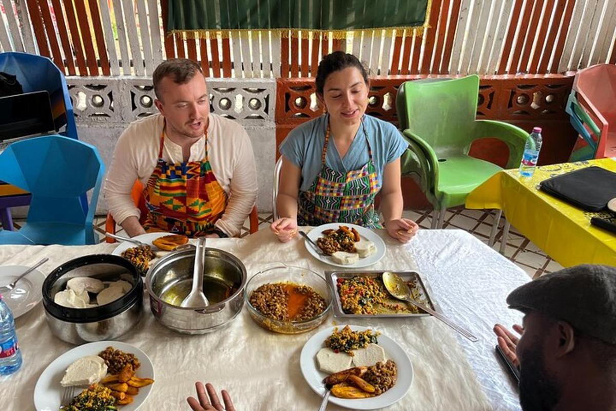 a man and a woman sitting at a table with food