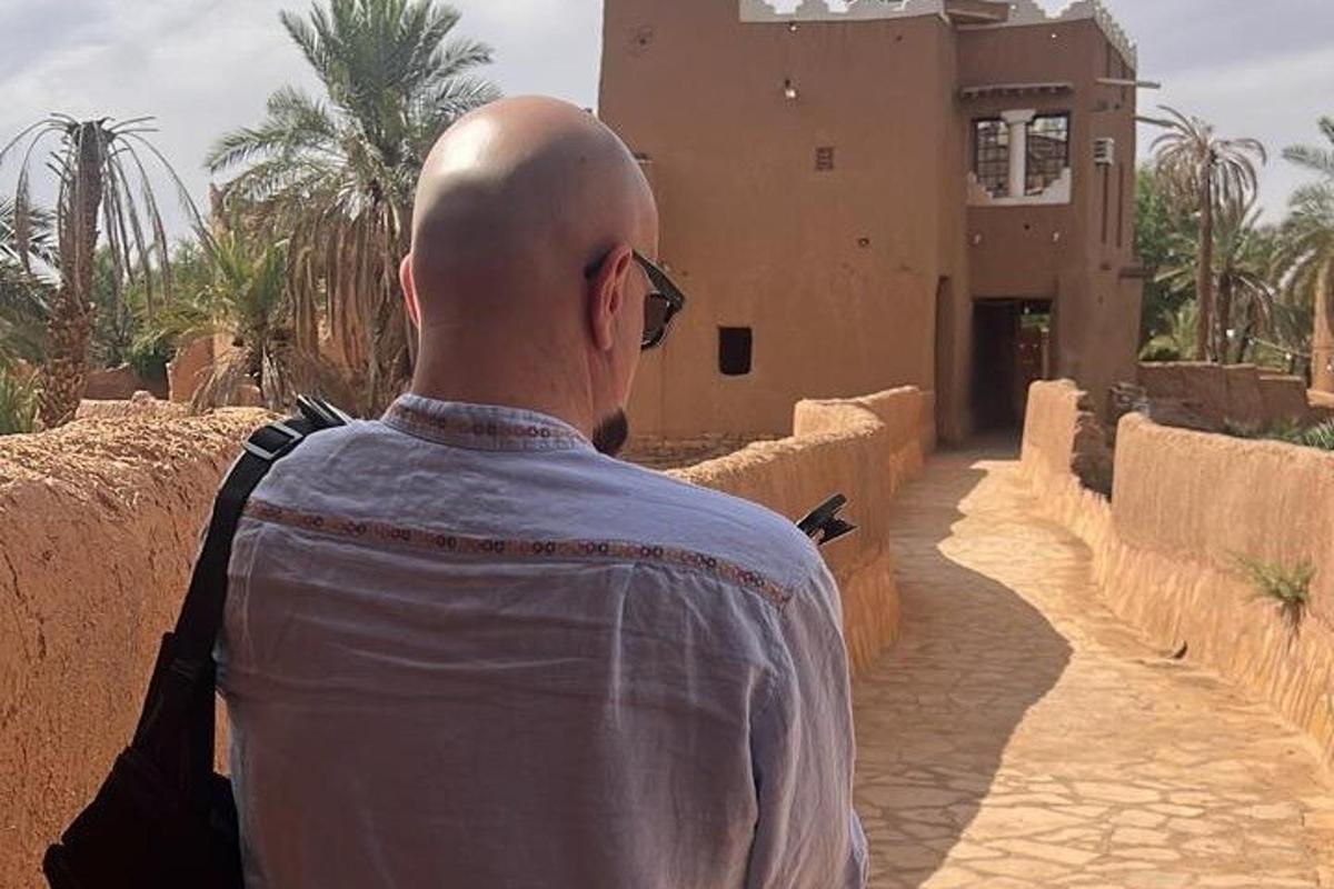 a man is standing in front of a building