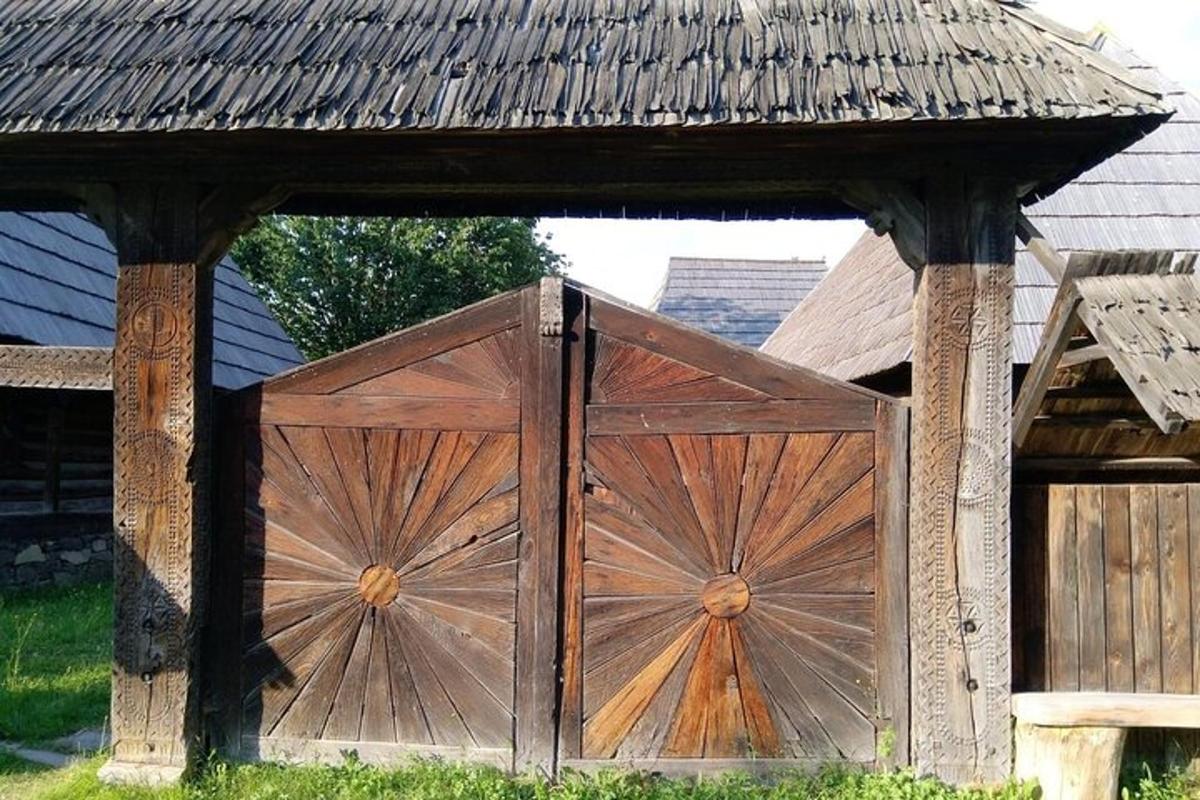 a wooden gate in front of a house