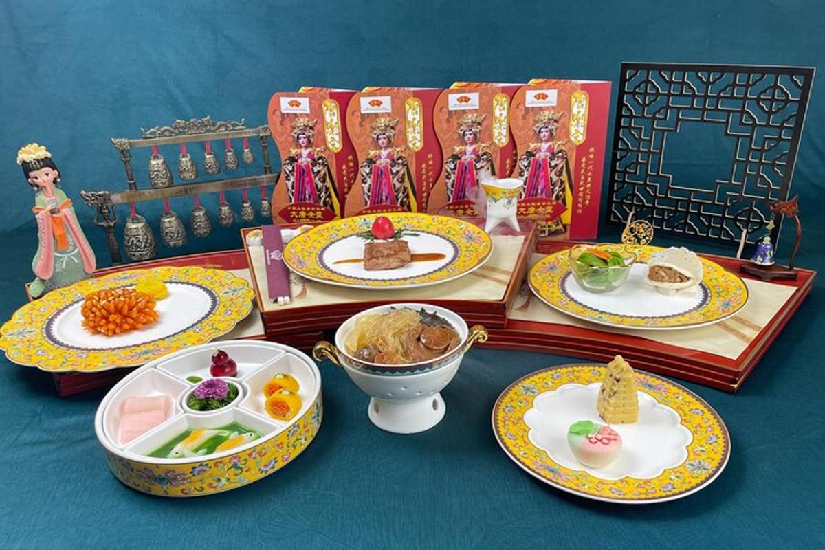 a table topped with plates of food on top