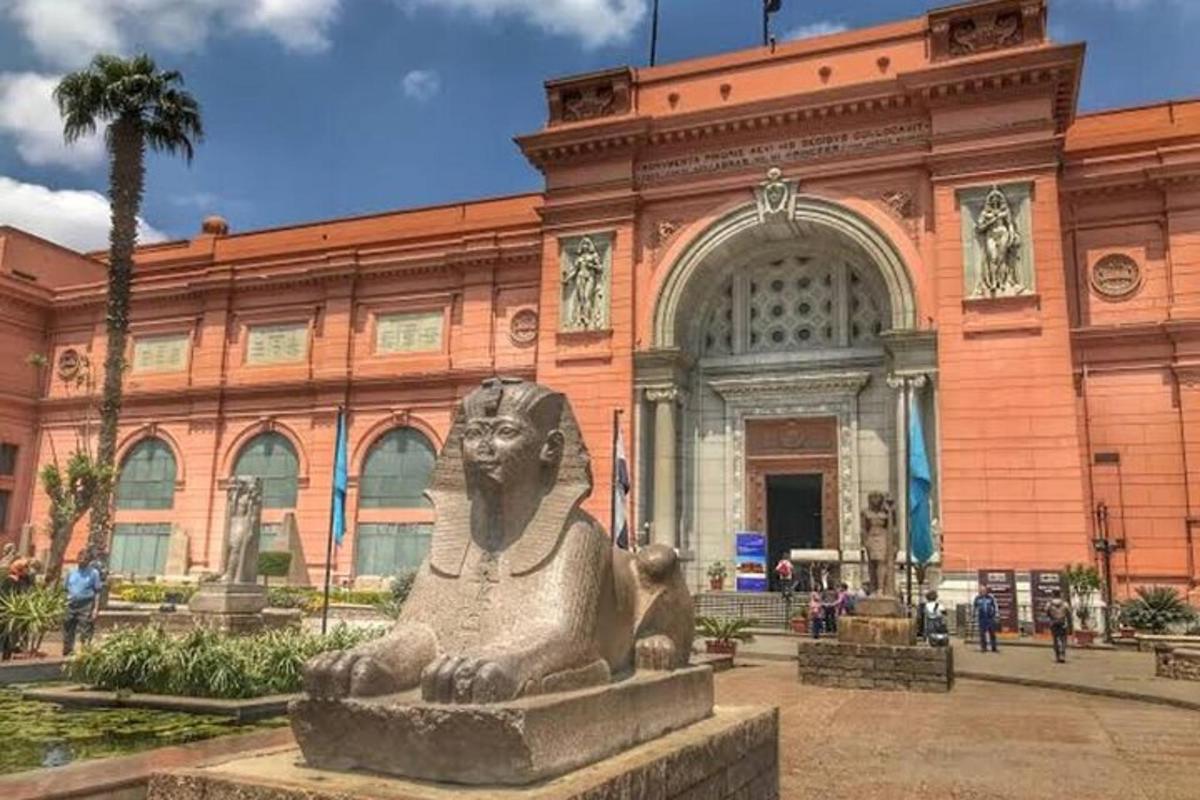 a large building with a statue in front of it