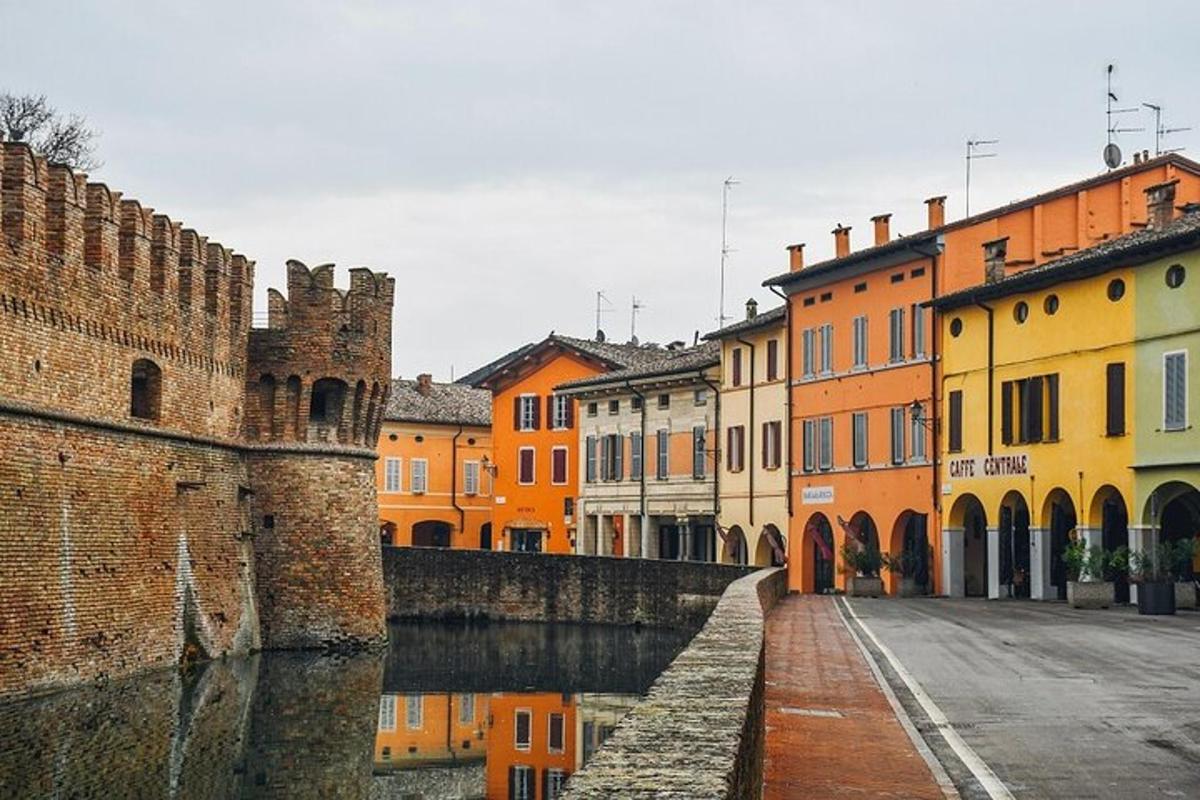 a group of buildings next to a canal in a city
