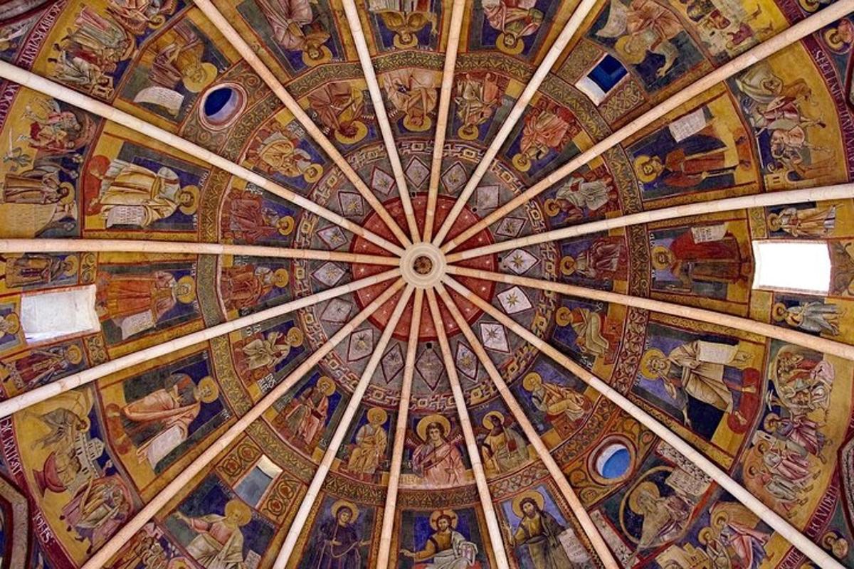 a ceiling of a church with paintings on it