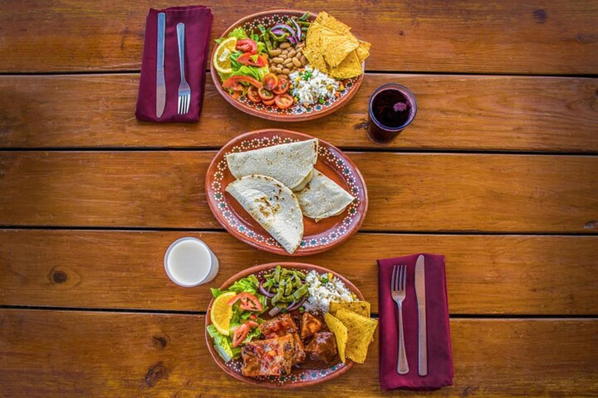a wooden table with two plates of food on it