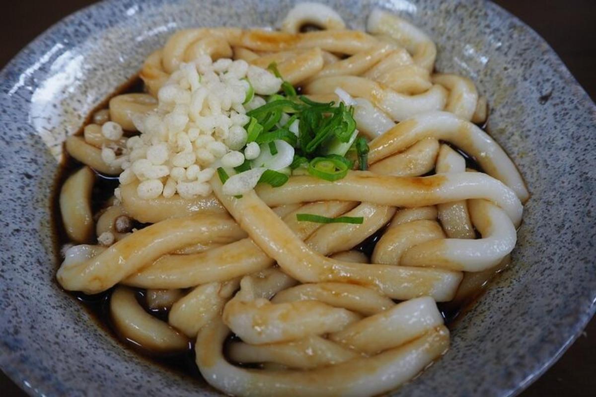 a bowl of pasta with rice and greens on it