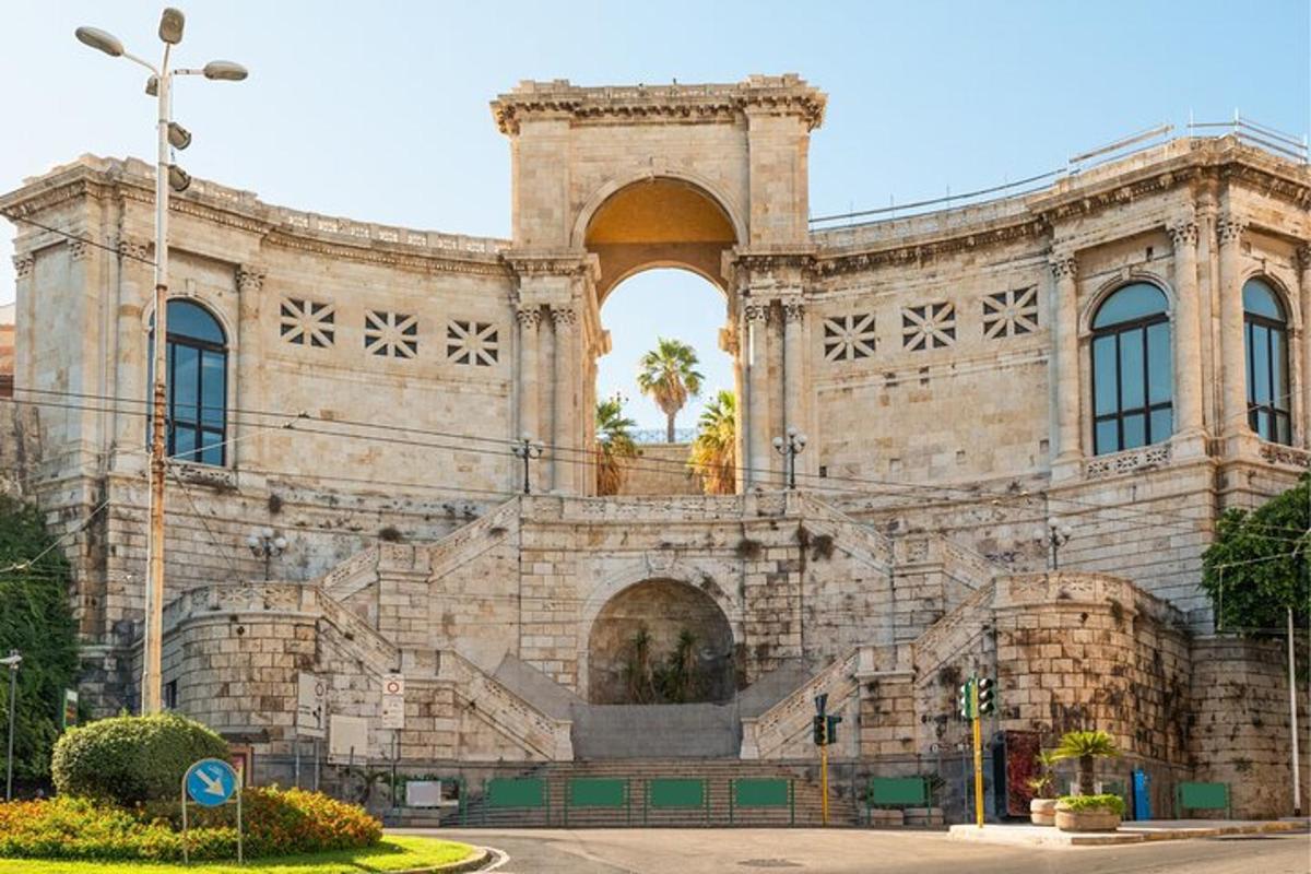 a large stone building with an arch on the front