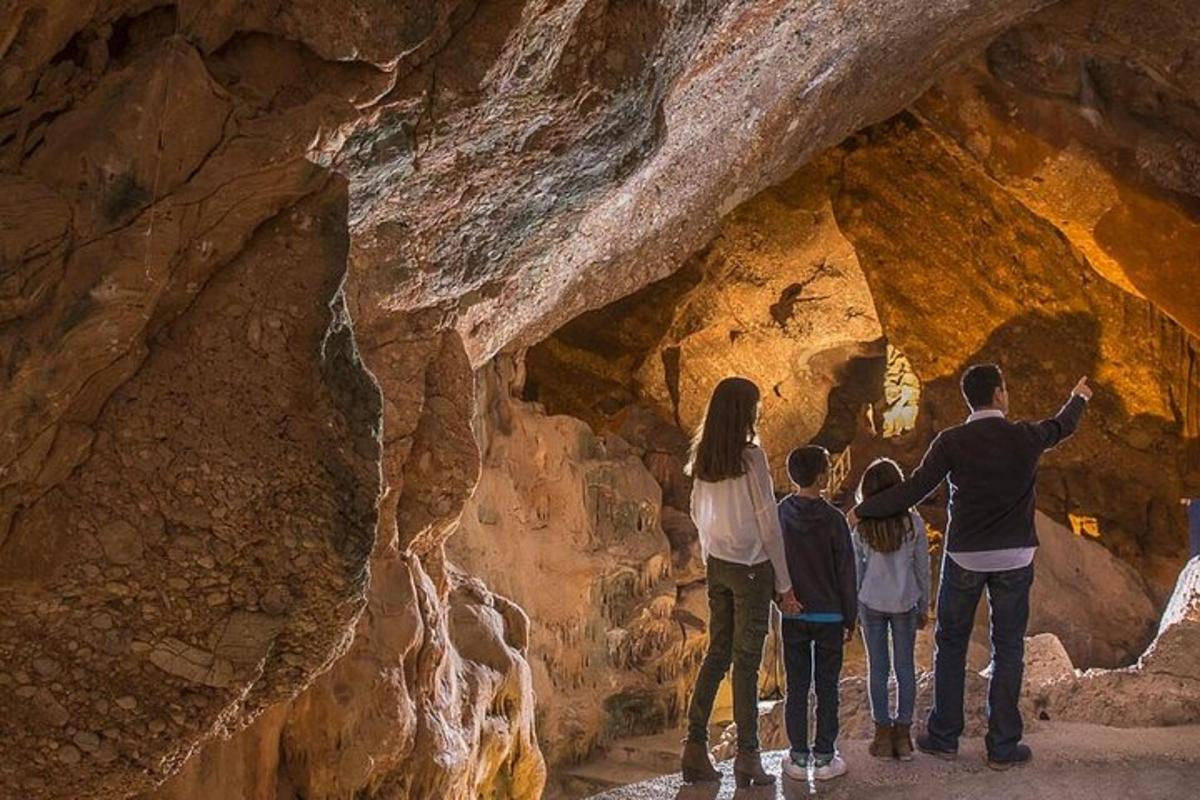 a group of people standing in a cave