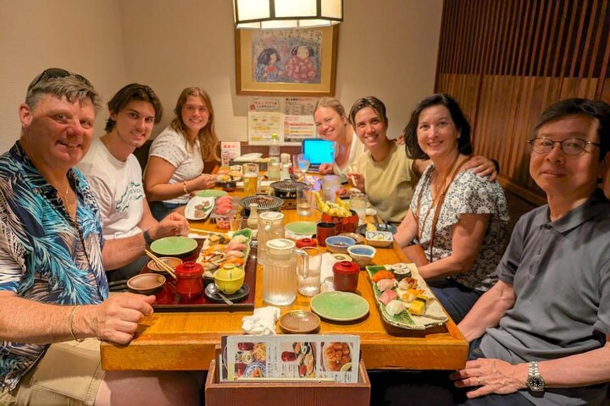 a group of people sitting around a table eating food