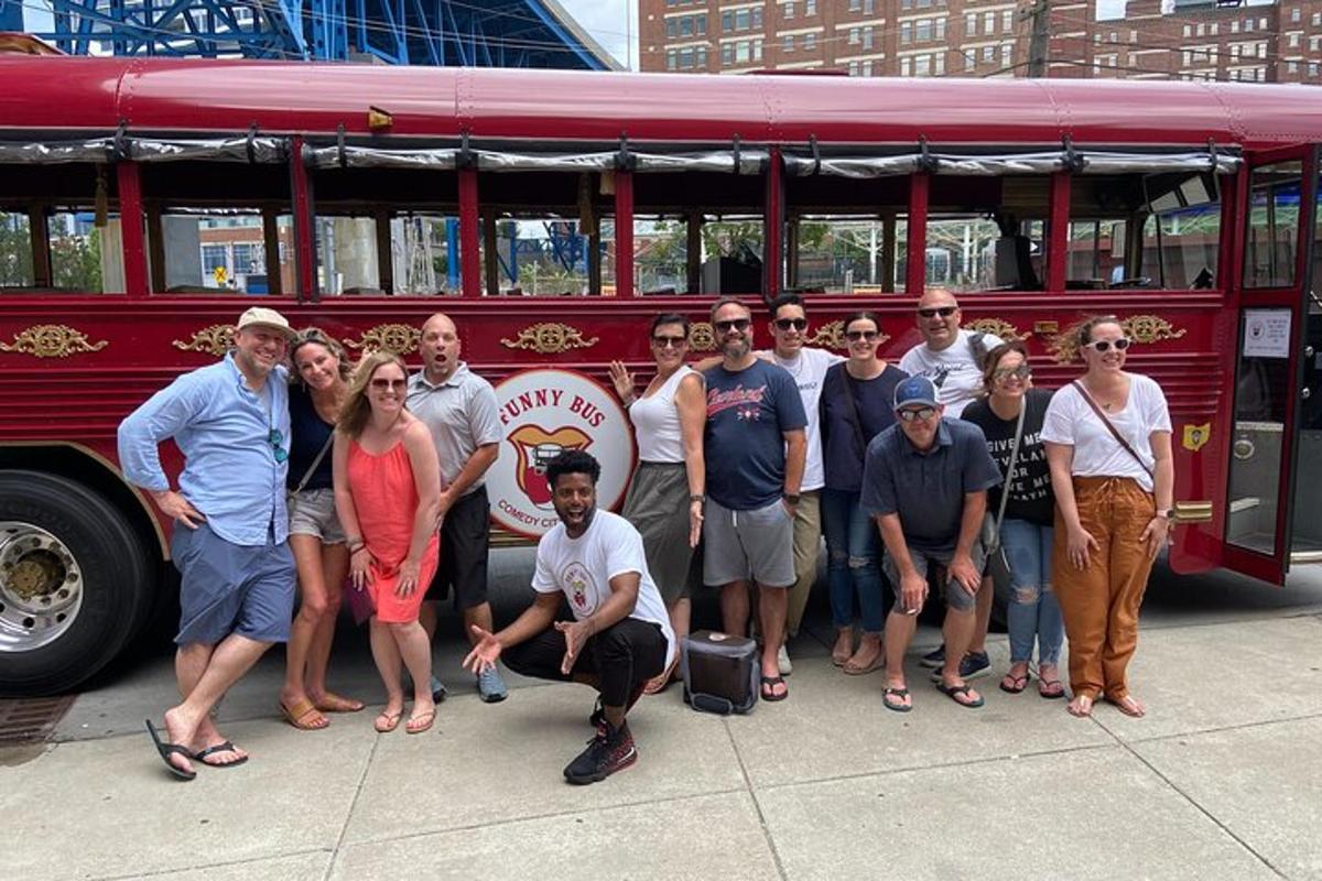 a group of people standing in front of a red bus