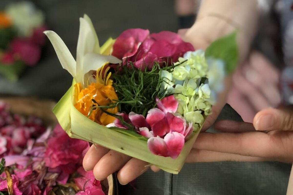 a person is holding a bouquet of flowers