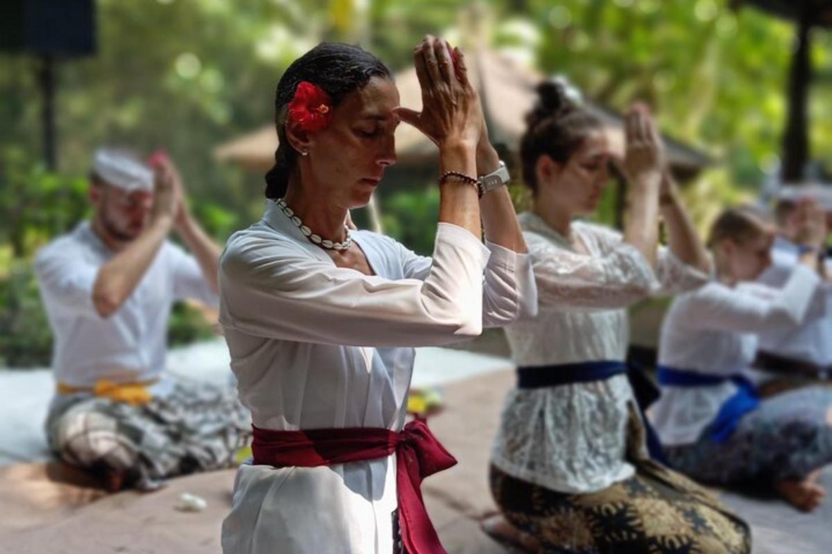 a group of people sitting on the ground doing yoga