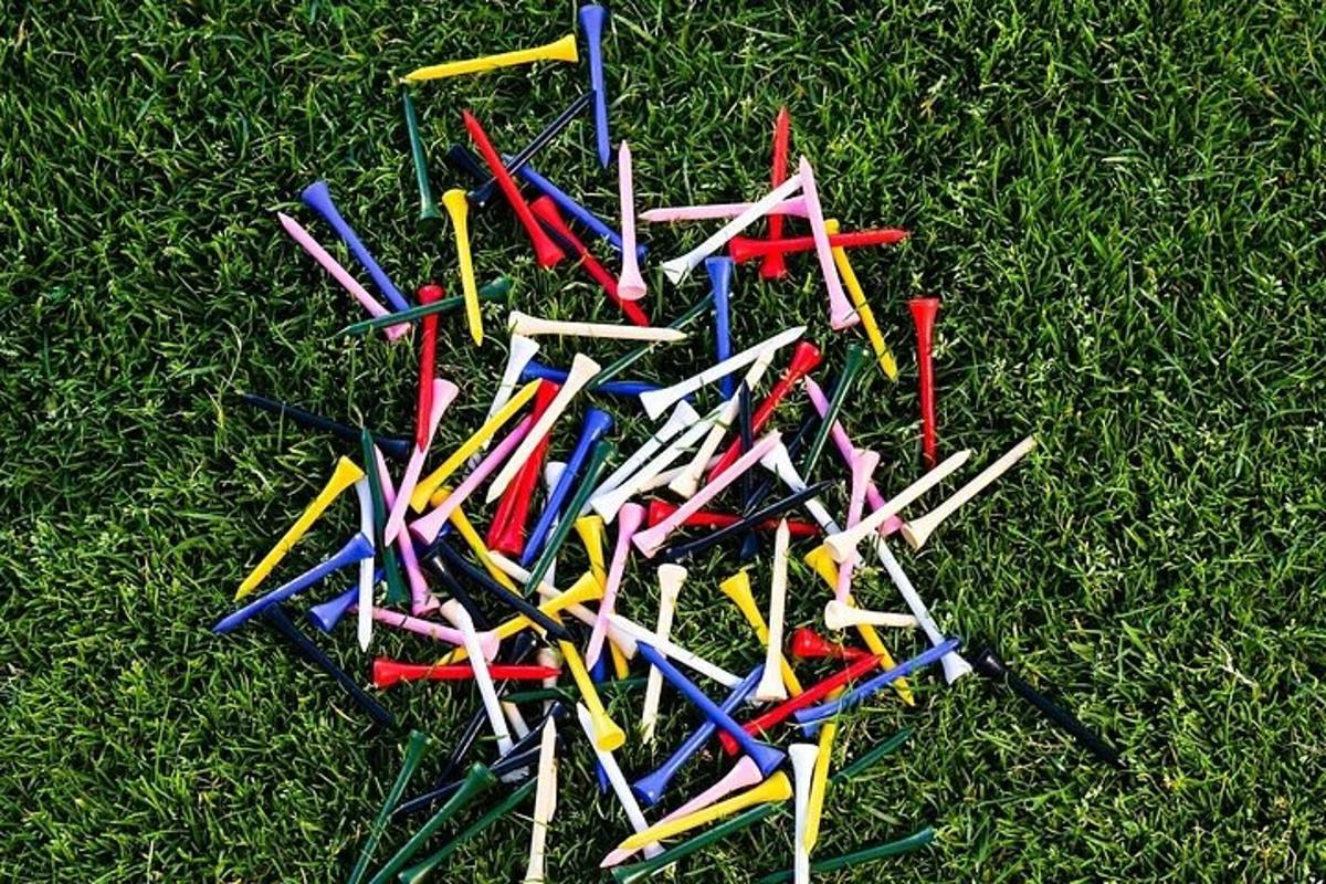 a pile of colored pencils sitting on the grass