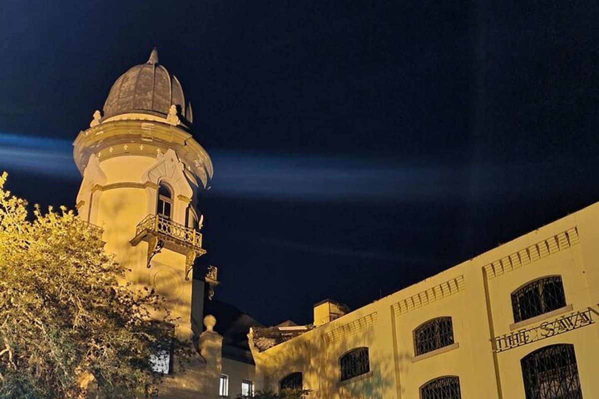 a building with a tower on top of it at night