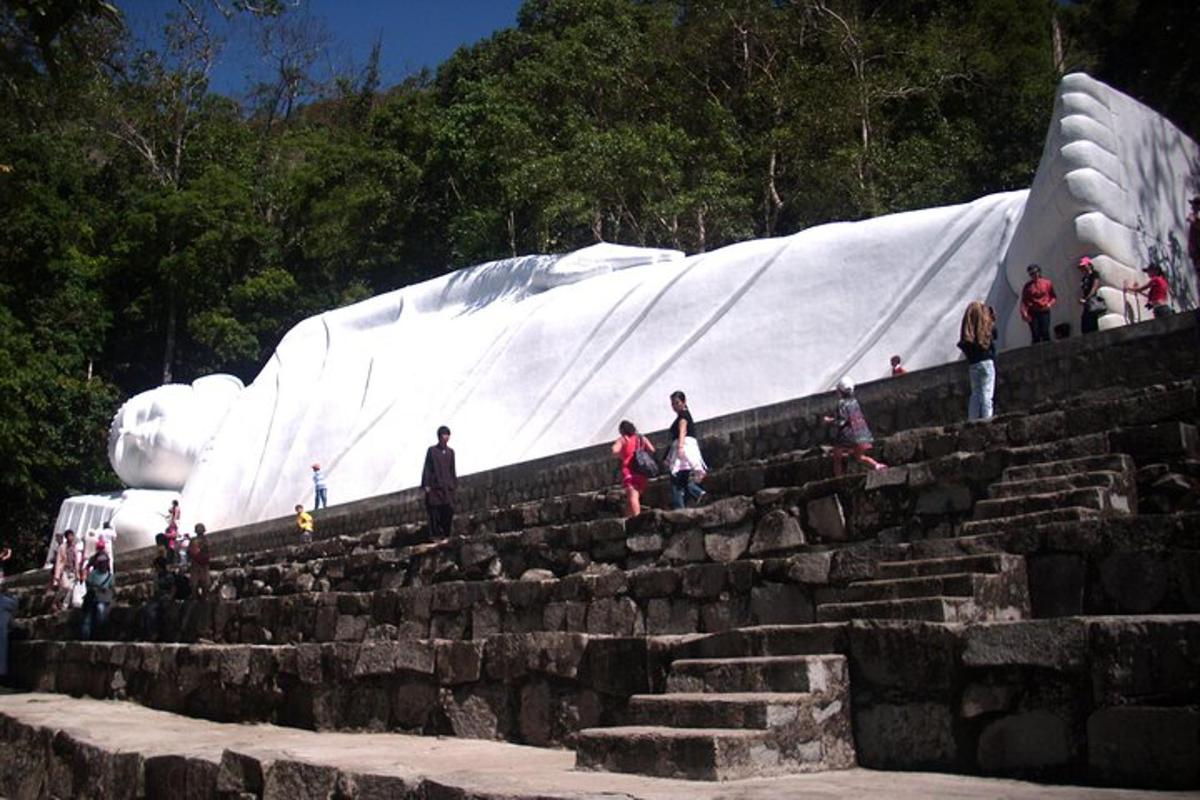 a group of people standing on steps in front of a slide