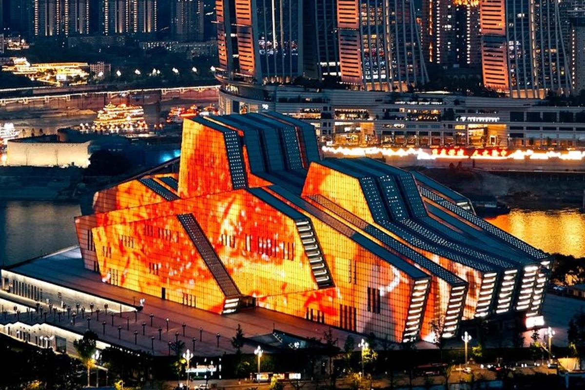 a building is lit up at night in a city