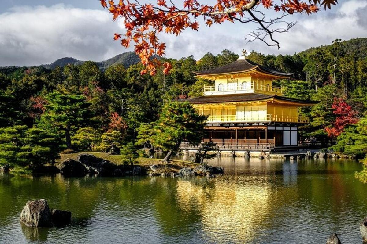 a chinese building in the middle of a lake